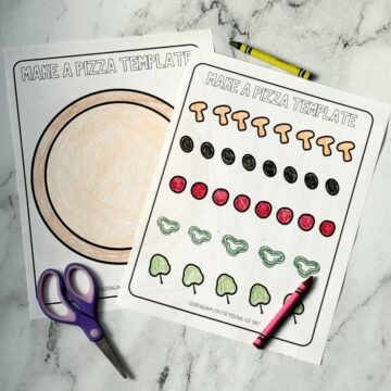 A photograph of the printable pizza craft templates on a marble background.
