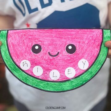 A child holding a watermelon themed Summer Name Craft.