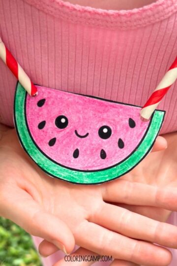 A child holding the summer necklace craft.