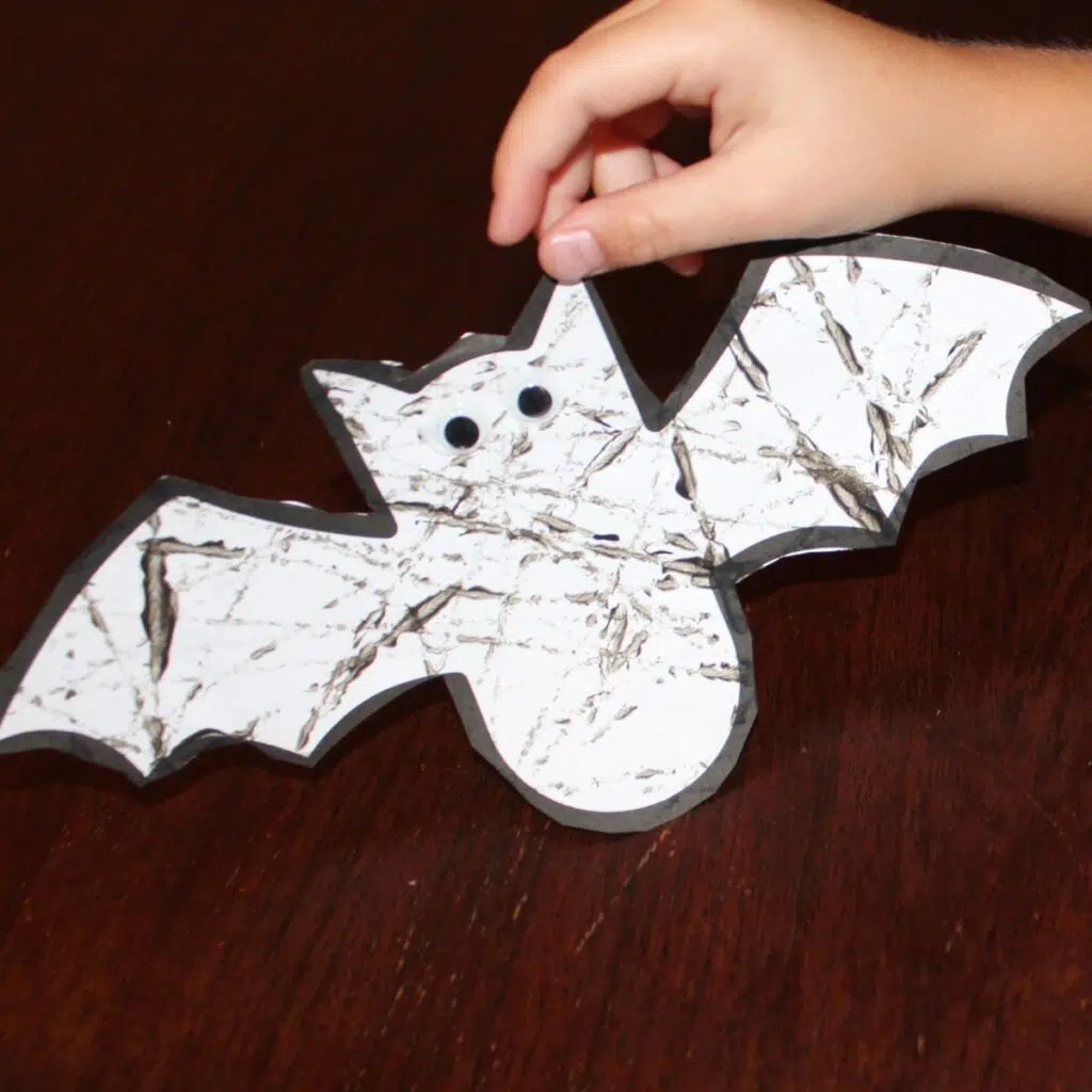 Bat craft with marble painting on it.