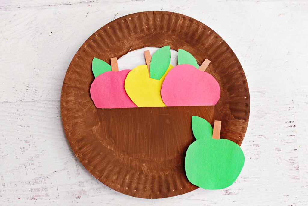Paper plate apple basket craft.